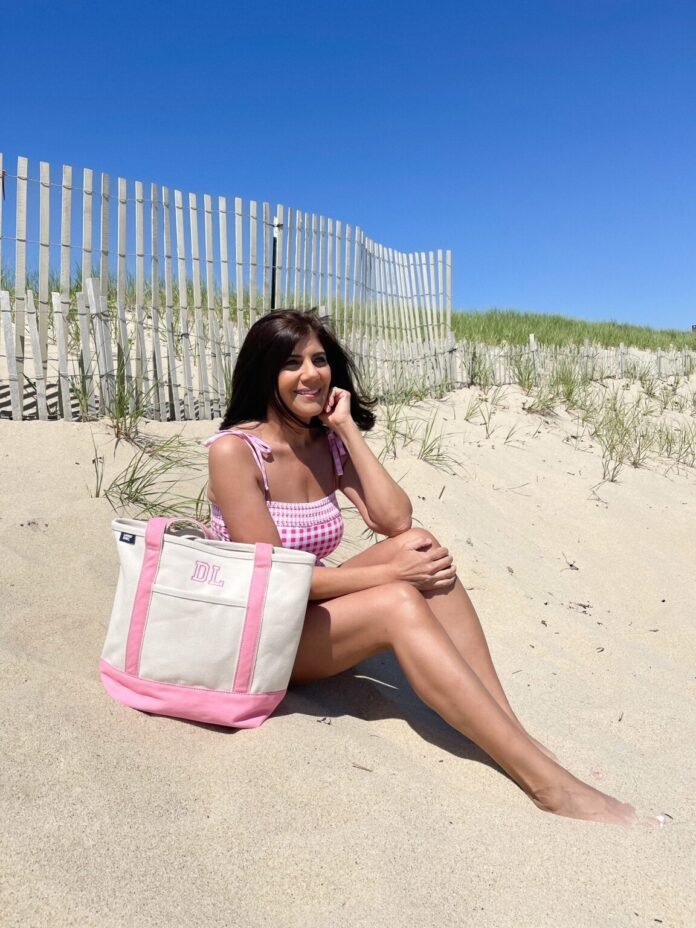 Desiree-Leone-in-Nantucket-wearing-Lands-End-pink-gingham-one-piece-swimsuit-1152x1536