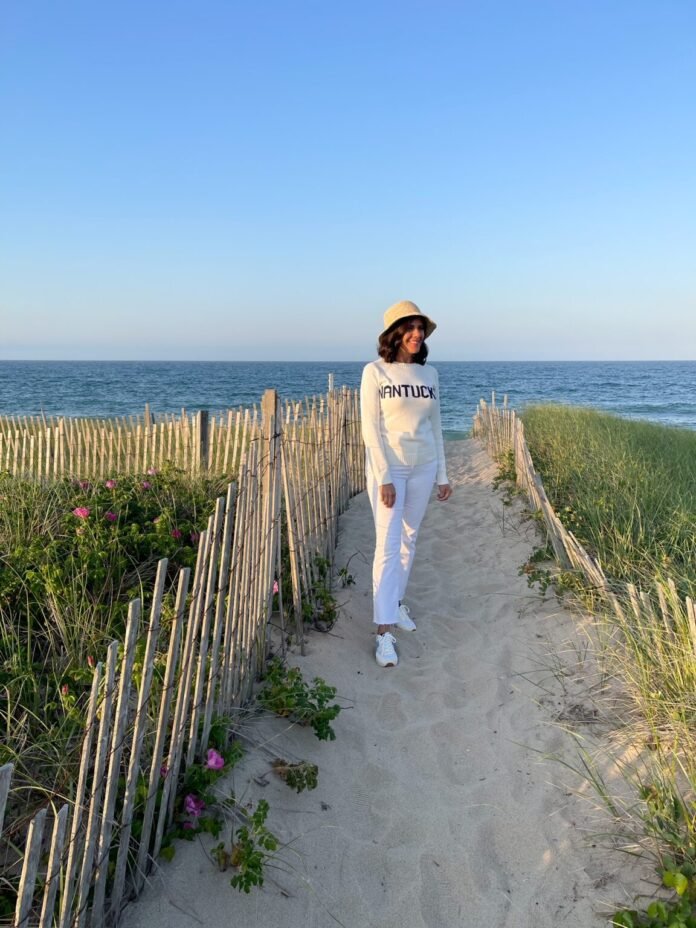 Desiree-Leone-in-Nantucket-wearing-Nantucket-sweater-and-white-jeans-1152x1536