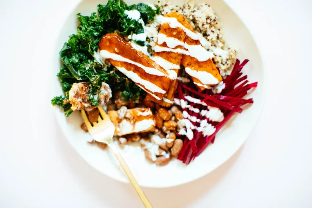 Colorful tempeh salad bowl with roasted vegetables