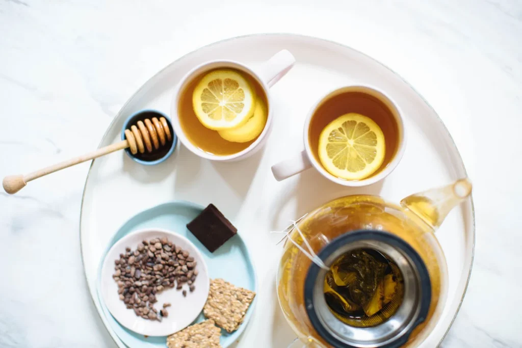 Tea set with herbal tea, nuts and crackers for mindful evening snacking