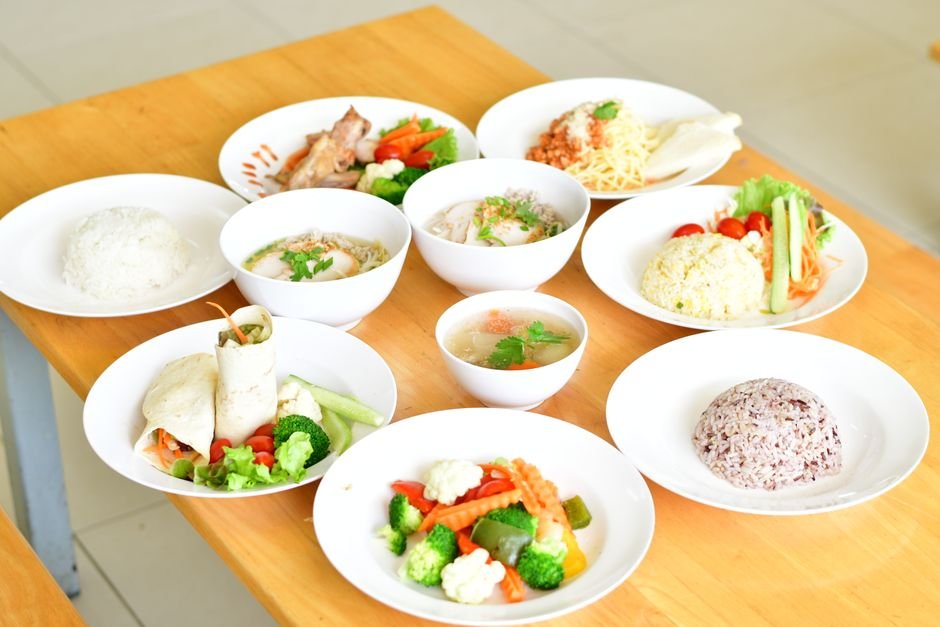 Variety of healthy dishes on wooden table