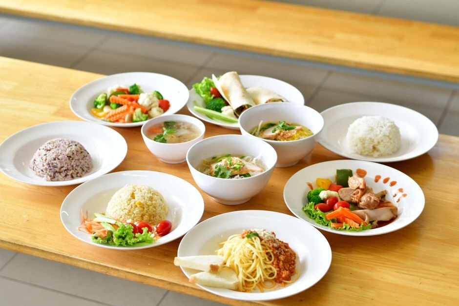 Asian and Italian dishes on wooden table
