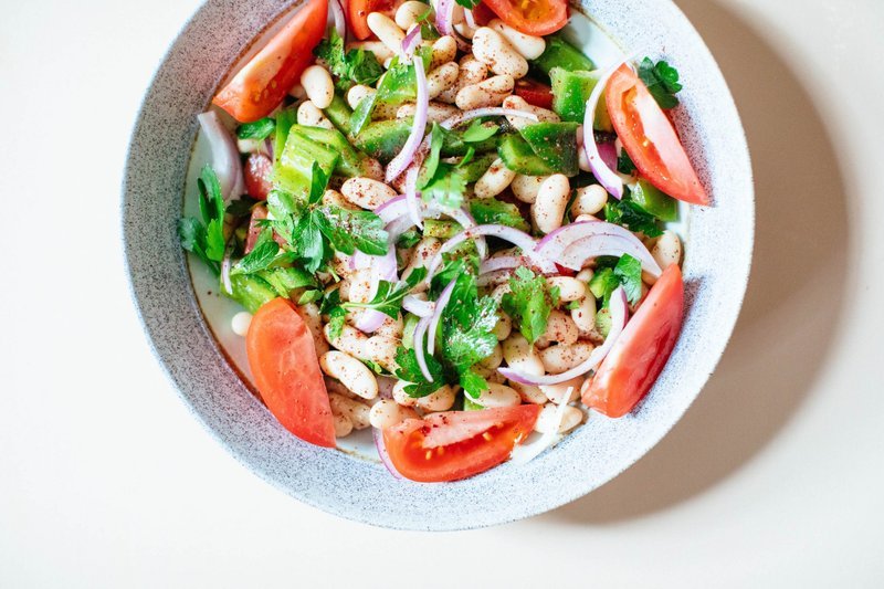 White bean and vegetable salad on a plate
