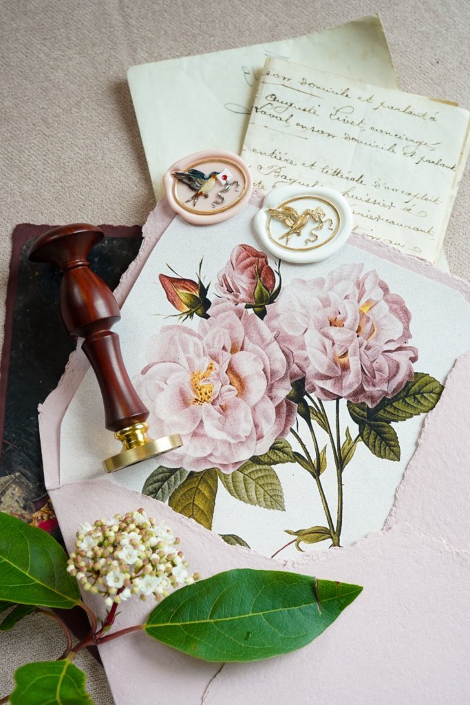 Intricate butterfly wax seal in ornate antique design style