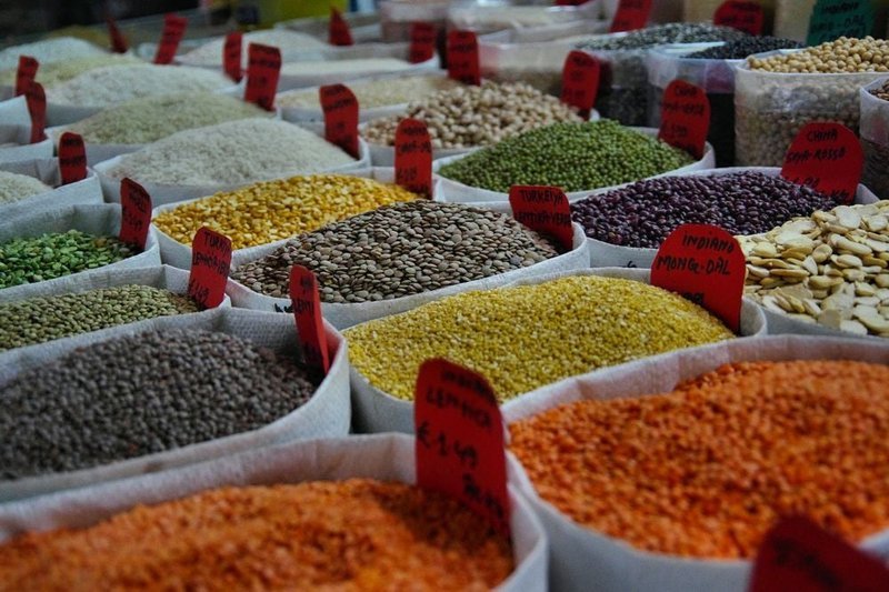 Colorful bulk bins filled with legumes and grains