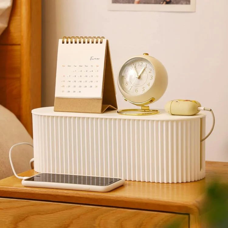 White ribbed desk organizer holding calendar clock and phone